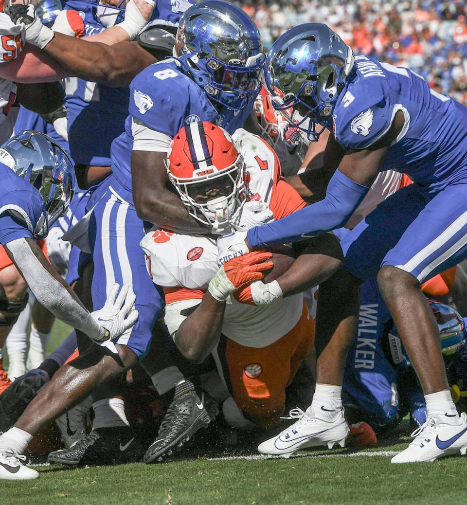 Clemson running back Phil Mafah (7) scores one of his four touchdowns against Kentucky in the TaxSlayer Gator Bowl. Ken Ruinard/USA TODAY NETWORK