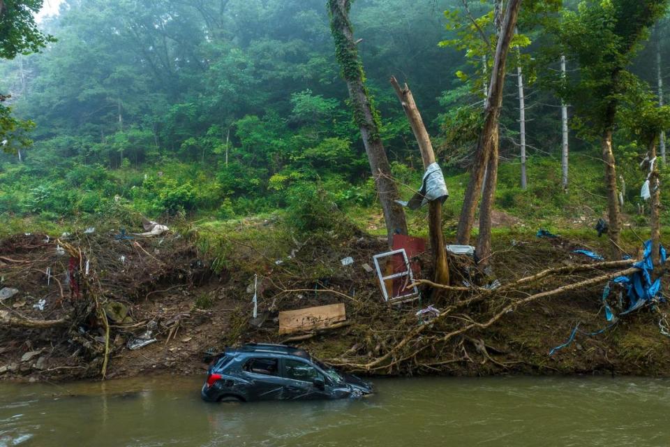 A vehicle is submerged in Troublesome Creek near Dwarf, Ky., on Thursday, Aug. 4, 2022. Flood waters devastated many communities in Eastern Kentucky last week.