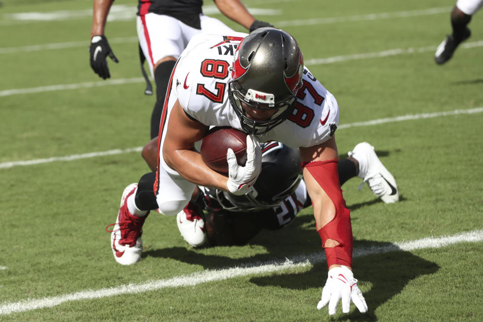 Tampa Bay Buccaneers tight end Rob Gronkowski (87) scores on a 20-yard touchdown pass during the first half of an NFL football game against the Atlanta Falcons Sunday, Sept. 19, 2021, in Tampa, Fla. (AP Photo/Mark LoMoglio)