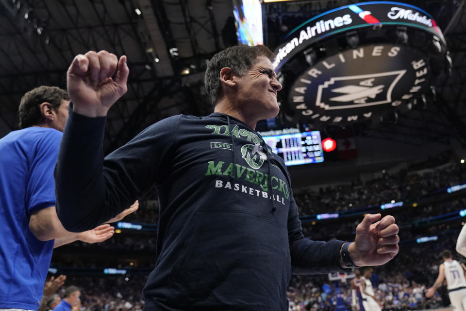 Dallas Mavericks owner Mark Cuban celebrates the team's win over the Phoenix Suns during in Game 3 of an NBA basketball second-round playoff series, Friday, May 6, 2022, in Dallas. (AP Photo/Tony Gutierrez)