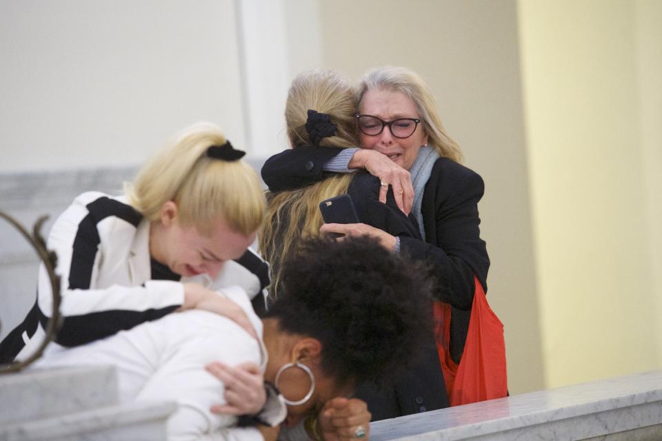 Bill Cosby's accusers embrace after the 80-year-old comedian was found guilty of three felony counts of aggravated indecent assault. (Photo: Mark Makela via Getty Images)