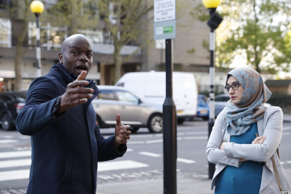 The Conservative party candidate for London Mayor, Shaun Bailey speaks to a local doctor Dr Yasmin Razak who complained about her surgery's state and lack of facilities in the Ladbroke Grove area of west London during a campaign stop in London, Thursday, April 29, 2021. (AP Photo/Alastair Grant)