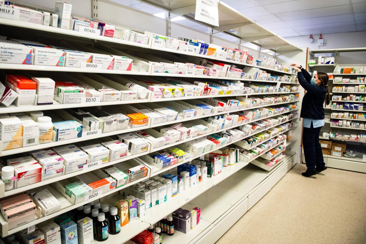 A trainee pharmacy staff member orders medications in drawers and shelves at the Monklands University Hospital, in Aidrie, Lanarkshire, during a visit by Scotland's First Minister Nicola Sturgeon on the launch of the Scottish Apprenticeship Week. See PA story SCOTLAND Apprenticeship. Photo credit should read: Andy Buchanan/PA Wire