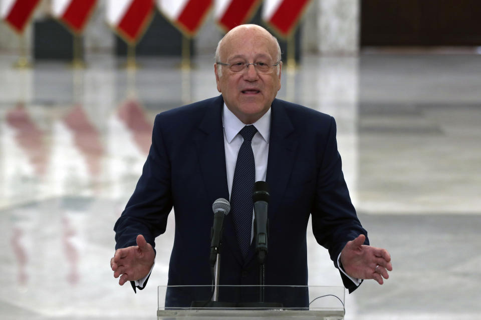 Lebanese Prime Minister-designate Najib Mikati, speaks to journalists after his meeting with Lebanese President Michel Aoun, at the Presidential Palace in Baabda, east of Beirut, Lebanon, Monday, July 26, 2021. Aoun appointed Mikati, a billionaire businessman and former prime minister as the next premier-designate Monday, after Saad Hariri earlier this month gave up attempts to form a Cabinet amid an unprecedented financial meltdown roiling the country. (AP Photo/Bilal Hussein)