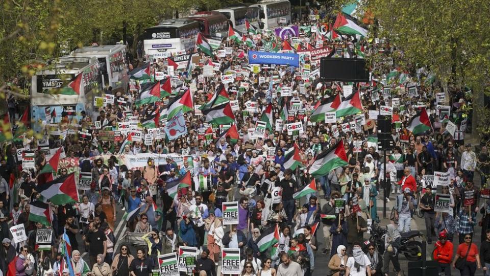 People take part in a pro-Palestinian march in central London on April 13