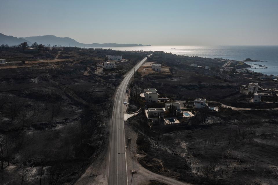 An aerial view shows Kiotari village, on the island of Rhodes on July 24, 2023. Tens of thousands of people have already fled blazes on the island of Rhodes, with many frightened tourists scrambling to get home.
Greece has been sweltering under a lengthy spell of extreme heat that has exacerbated wildfire risk and left visitors stranded in peak tourist season. (Photo by Spyros BAKALIS / AFP) (Photo by SPYROS BAKALIS/AFP via Getty Images)