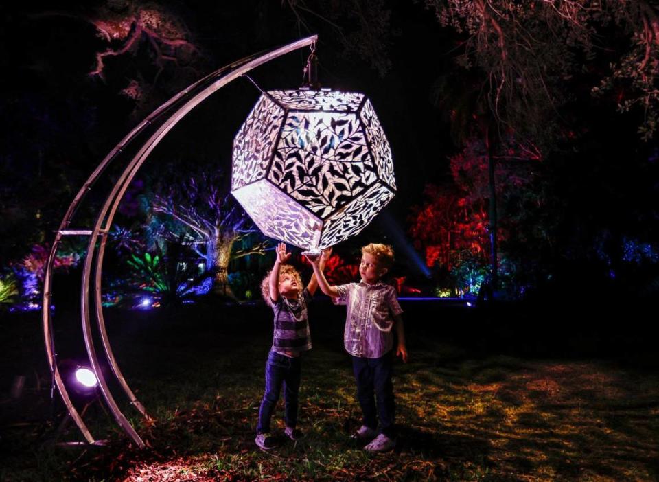 Brothers Karim Zakhia, 2, and Charbel Zakhia, 5, left to right, view the Shadow Shapes along the path at the NightGarden.