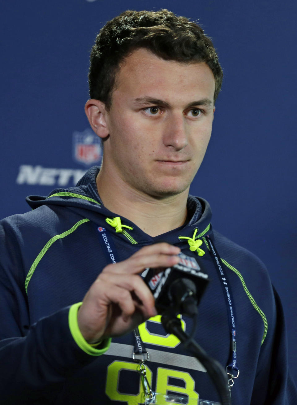 Texas A&M quarterback Johnny Manziel answers a question during a news conference at the NFL football scouting combine in Indianapolis, Friday, Feb. 21, 2014. (AP Photo/Michael Conroy)