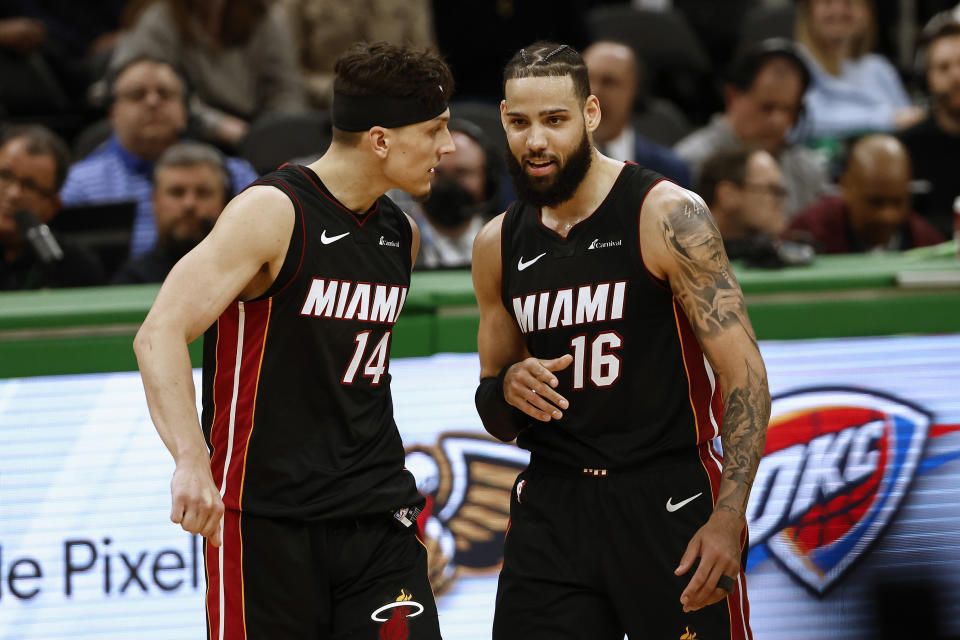 BOSTON, MA - APRIL 24: (L-R) Tyler Herro #14 and Caleb Martin #16 of the Miami Heat celebrate together during the fourth quarter of their win over the Boston Celtics in game two of the Eastern Conference First Round Playoffs at TD Garden on April 24, 2024 in Boston, Massachusetts. NOTE TO USER: User expressly acknowledges and agrees that, by downloading and/or using this Photograph, user is consenting to the terms and conditions of the Getty Images License Agreement. (Photo By Winslow Townson/Getty Images)