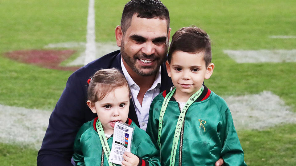 Greg Inglis, pictured here with son Nate and daughter Quinnsy after announcing his retirement in 2019.