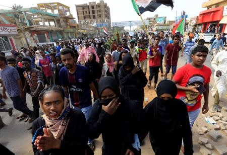 People demonstrate against the killing of protesting children, who were shot dead when security forces broke up a student protest in Khartoum