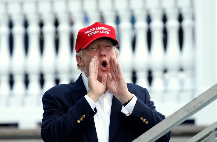 Trump shouts as he arrives at the U.S. Women's Open golf tournament at Trump National Golf Club in Bedminster, N.J., on Saturday. (Kevin Lamarque/Reuters)