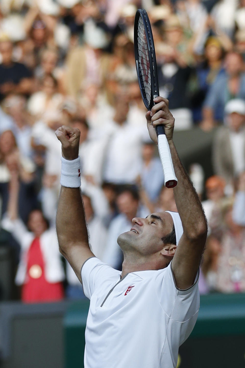 Switzerland's Roger Federer celebrates after beating Spain's Rafael Nadal in a Men's singles semifinal match on day eleven of the Wimbledon Tennis Championships in London, Friday, July 12, 2019. (Adrian Dennis/Pool Photo via AP)