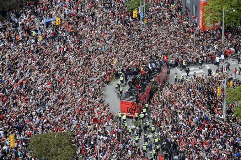 Four people have been injured in a shooting as millions of fans were celebrating at a Toronto Raptors victory parade in Canada.Crowds were forced to flee Nathan Phillip’s Square, Toronto, where the NBA team were celebrating their championship win on Monday.Dramatic footage showed people running from the scene as police worked to clear the area.Officers confirmed four victims suffered gunshot injuries.> I’m on the roof of city hall and something is happening. People are running including what looks to be cops and security pic.twitter.com/FEbhw88OqI> > — Jennifer Pagliaro (@jpags) > > June 17, 2019Police Chief Mark Saunders said none of those injured were in a life-threatening condition.Others suffered minor injuries as they tried to get away from the shooting, police said.An investigation has been launched and two firearms were recovered from the area.Three people have been arrested.Canada's prime minister Justin Trudeau was among the two million fans cheering at the a victory parade through the city.Nathan Phillips Square was the parade's final destination. At least two million fans were reported to have attended.The incident caused only a brief pause in the celebratory speeches, which were still going on.The incident is believed to have unfolded in Bay Street and Albert Street.Bruce Arthur, a sports columnist for the Toronto Star, said police were telling crowds to "get down" amid the shocking scenes.> SHOOTING: > Nathan Phillip's Square > -Bay St and Albert St > -Police have located 2 victims > -Injuries serious but not life threatening > -2 people in custody > -2 firearms recovered > -Investigating > ^dh> > — Toronto Police OPS (@TPSOperations) > > June 17, 2019"Crowd on east side running again. Cops said get down. Oh no," he wrote on Twitter."Gunshots fired at the parade at the back south east corner of Nathan Phillips Square. One witness said four shots. Crowd ran."There is a victim down being given medical attention, surrounded by a crowd, and police are clearing people from the area. Speeches are still going on."