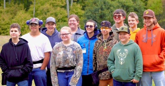 The Pellston clay target team had success in its first season, sending eight participants to the state finals. Members of the team include (from left to right) Brayden LaPeer, Orrin Searles, Brach Taylor, Alivia Broman, head coach Kathleen Blust, Nathan Tennant, Zac Jamroz, Seth Searles, Brody Taylor, Jack Schmalzried and Garrett Cameron.