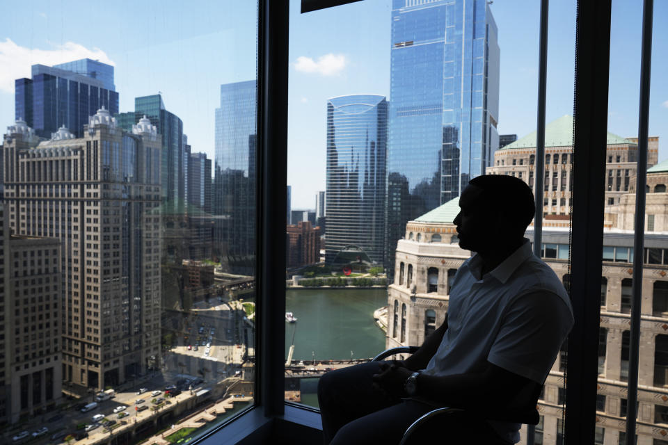 Adrian Perkins looks at the view from his office in Chicago, Thursday, June 13, 2024. (AP Photo/Nam Y. Huh)