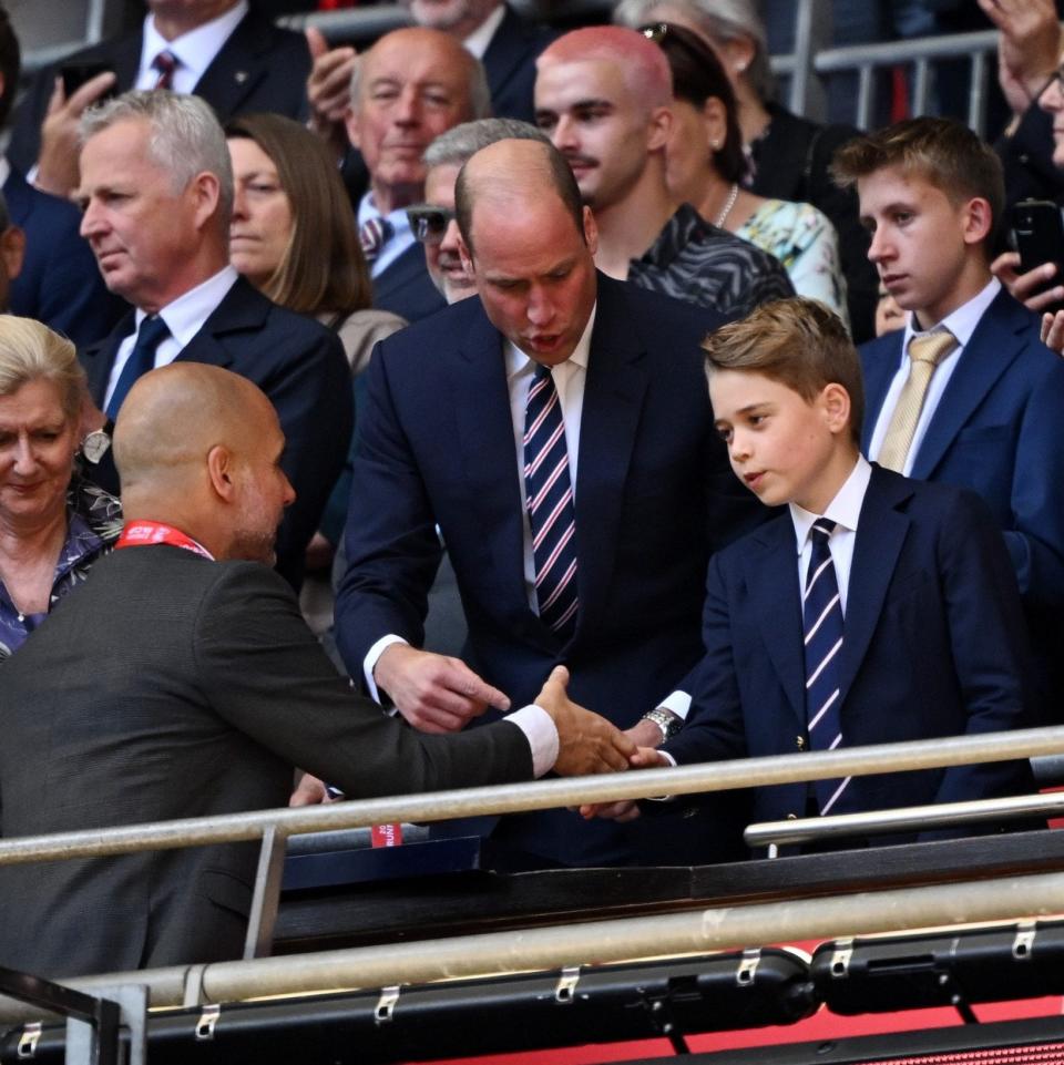 Prince George shakes hands with Pep Guardiola