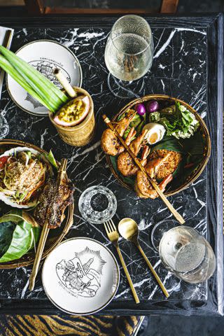 <p>Chris Schalkx</p> Funky rooftop spot Rongros serves a vibrant array of noodle dishes, grilled meat, and seafood.