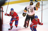 Montreal Canadiens' Jesperi Kotkaniemi, left, and Joel Armia celebrate a goal by Josh Anderson on Vegas Golden Knights goaltender Marc-Andre Fleury during the third period of Game 3 of an NHL hockey semifinal series, Friday, June 18, 2021, in Montreal. (Paul Chiasson/The Canadian Press via AP)