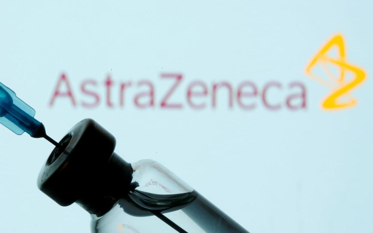 A vial and sryinge are seen in front of a displayed AstraZeneca logo in this illustration taken January 11, 2021. REUTERS/Dado Ruvic/Illustration/File Photo - Dado Ruvic/REUTERS