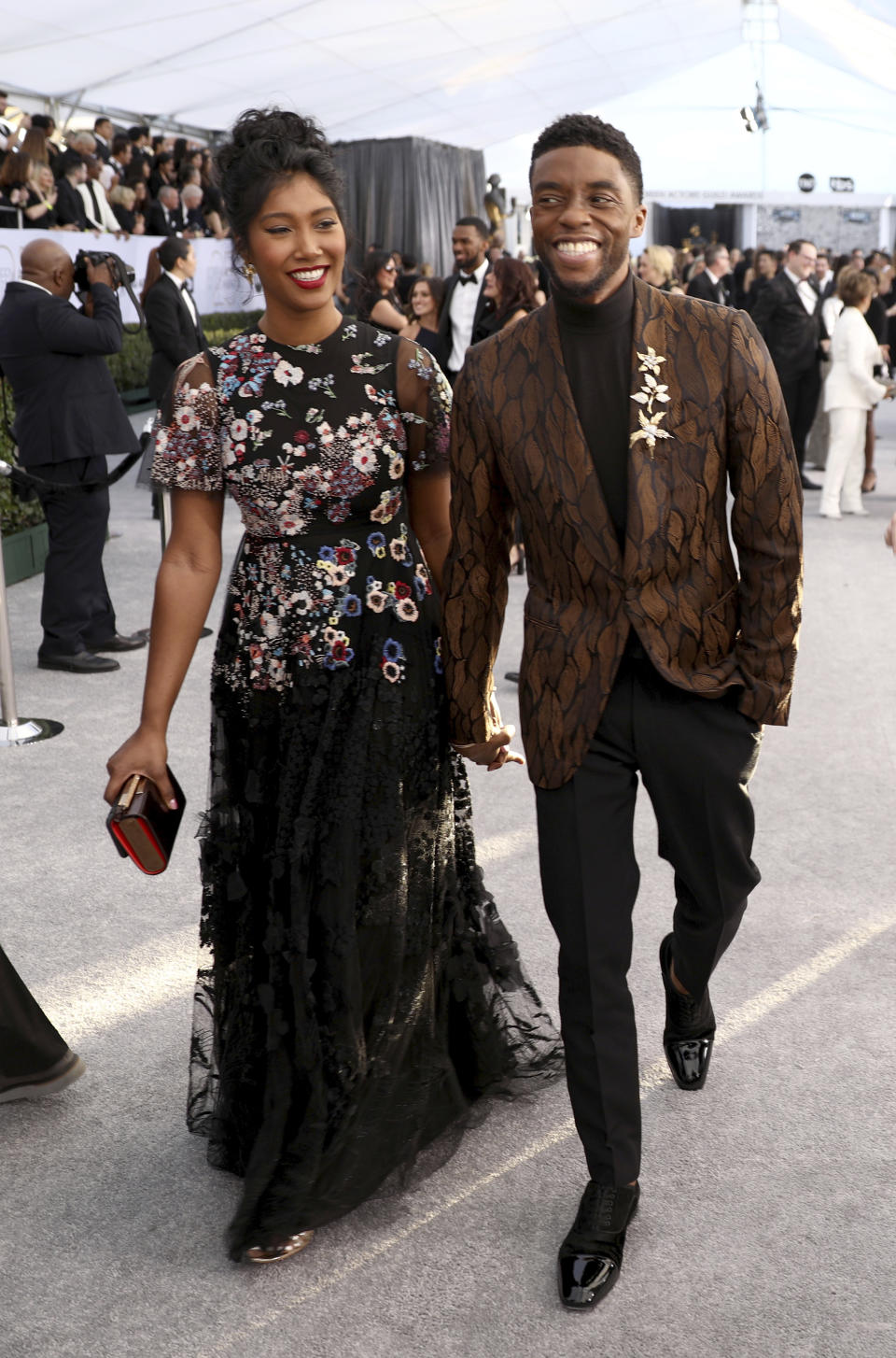 FILE - In this Jan. 27, 2019 file photo, Chadwick Boseman, right, and Taylor Simone Ledward arrive at the 25th annual Screen Actors Guild Awards at the Shrine Auditorium & Expo Hall on Sunday in Los Angeles. Boseman, who played Black icons Jackie Robinson and James Brown before finding fame as the regal Black Panther in the Marvel cinematic universe, has died of cancer. His representative says Boseman died Friday, Aug. 28, 2020 in Los Angeles after a four-year battle with colon cancer. He was 43. (Photo by Matt Sayles/Invision/AP, File)