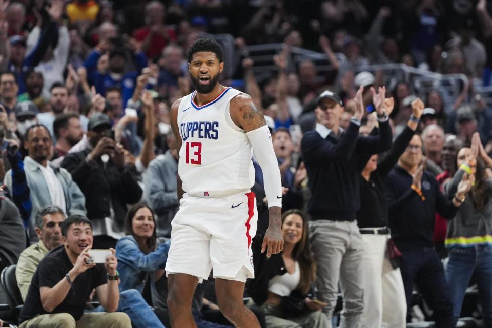 Clippers forward Paul George reacts after scoring the go-ahead basket during a win over the Cavaliers.