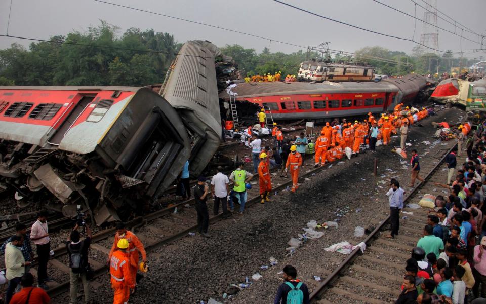 More than a dozen train cars were derailed or damaged in the crash - AP