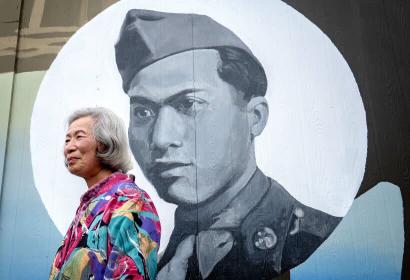 EUREKA, CA - SEPTEMBER 02: Mary Chin says she misses her husband Ben Chin upon seeing his picture on a mural painted by artist Dave Young Kim in Eureka's Chinatown. Ben Chin was the first person of Chinese descent to live in the city since it excluded Asians in 1885 and forced them onto ships bound for San Francisco. Chin died in 2019 at age 97, but Mary and his adult children are continuing his legacy of rebuilding the Asian community there. Photographed on Friday, Sept. 2, 2022 in Eureka, CA. (Myung J. Chun / Los Angeles Times)