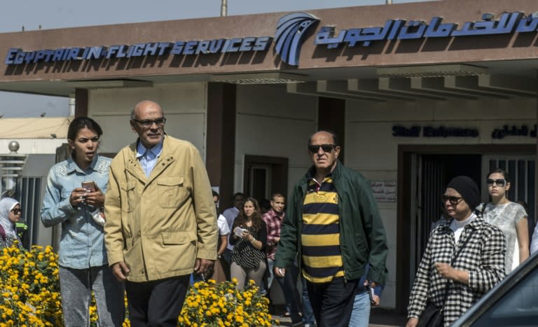 Relatives of passengers who were flying in an EgyptAir plane that vanished from radar en route from Paris to Cairo leave a services hall at Cairo airport on May 19, 2016