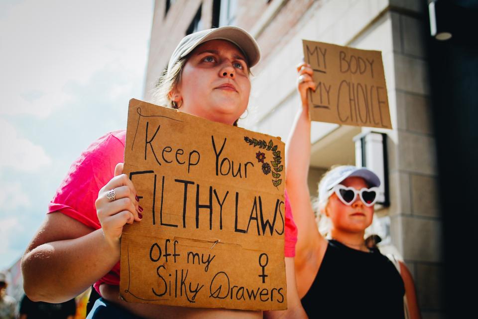 Protesters for reproductive rights march on May 14, 2022, through downtown Columbia, Mo.