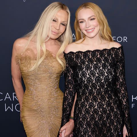 <p>Ammar Rowaid/Patrick McMullan via Getty</p> Donatella Versace and Lindsay Lohan