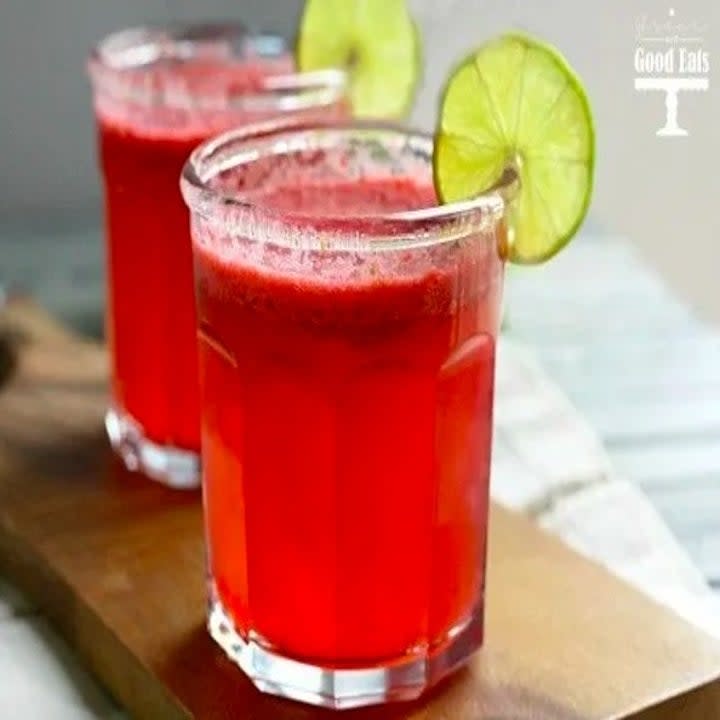 Two glasses of fresh raspberry lime agua fresca