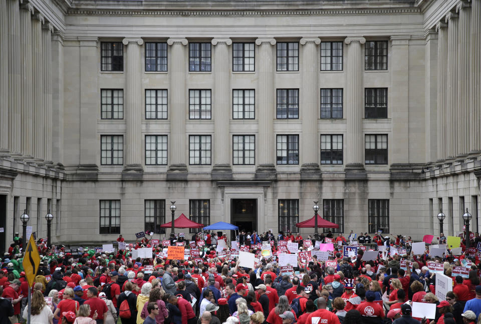 Protesters rally against benefit cuts in Trenton, N.J., Thursday, June 13, 2019. Spurred on by a tweet from U.S. Sen. Bernie Sanders, thousands of union members crowded around New Jersey's legislative annex Thursday, even spilling into the street, to protest state Senate President Steve Sweeney's calls to cut some worker benefits. (AP Photo/Seth Wenig)