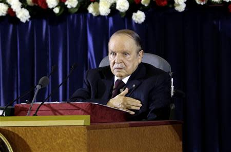President Abdelaziz Bouteflika gestures during a swearing-in ceremony in Algiers April 28, 2014. REUTERS/Louafi Larbi