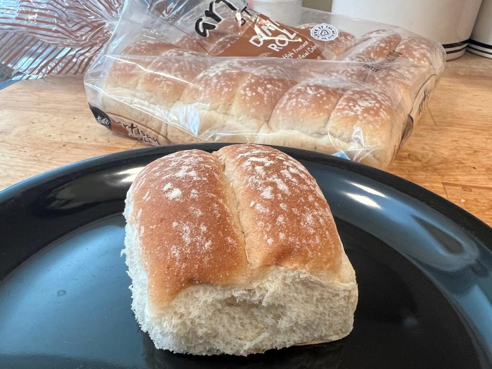 signature select dinner roll on a black plate