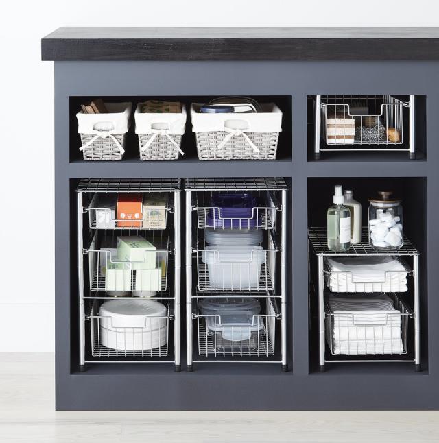 under sink roll outs maximize your cabinet space. www