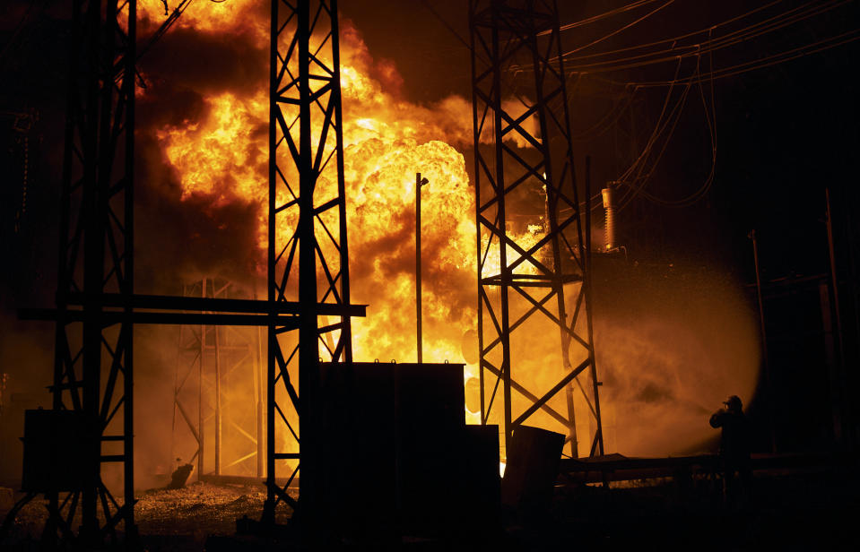 Ukrainian State Emergency Service firefighters put out the fire after a Russian rocket attack hit an electric power station in Kharkiv, Ukraine, Sunday, Sept. 11, 2022. The Kharkiv and Donetsk regions have been completely de-energised in the rocket attack.(AP Photo/Kostiantyn Liberov)