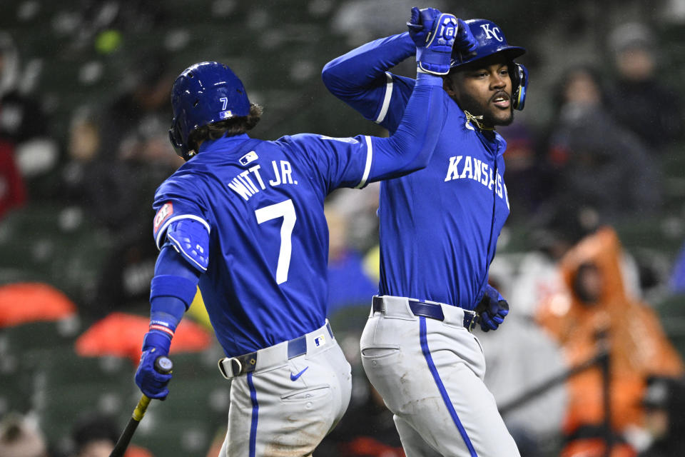 Kansas City Royals' Maikel Garcia, right, celebrates his home run against the Baltimore Orioles with Bobby Witt Jr. during the seventh inning of a baseball game Wednesday, April 3, 2024, in Baltimore. (AP Photo/Nick Wass)