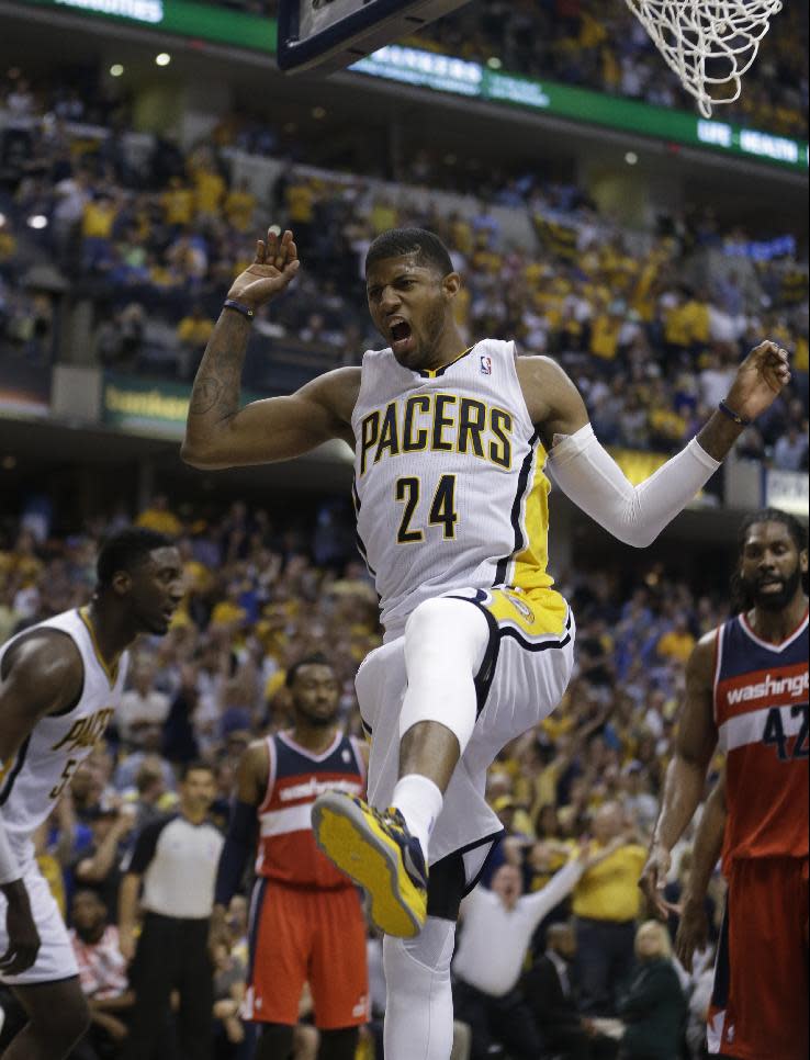 Indiana Pacers' Paul George (24) dunks during the second half of game 2 of the Eastern Conference semifinal NBA basketball playoff series against the Washington Wizards Wednesday, May 7, 2014, in Indianapolis. Indiana defeated Washington 86-82. (AP Photo/Darron Cummings)