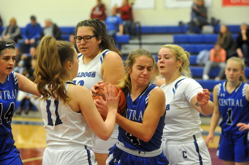 Kidron Central Christian's Jocelyn Horst keeps the ball away from Crestline's Ellie Miller and Brooklyn Gregory.