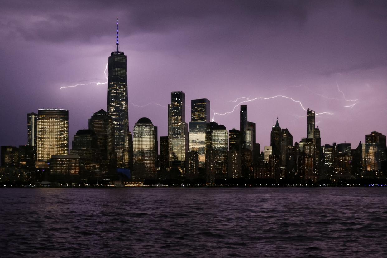 Lightning is seen behind the One World Trade Center on the day of the 22nd anniversary of the September 11, 2001 attacks, viewed from Jersey City, New Jersey, U.S., September 11, 2023. REUTERS/Jeenah Moon