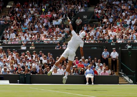 Britain Tennis - Wimbledon - All England Lawn Tennis & Croquet Club, Wimbledon, England - 3/7/16 Spain's Feliciano Lopez in action against Australia's Nick Kyrgios REUTERS/Stefan Wermuth