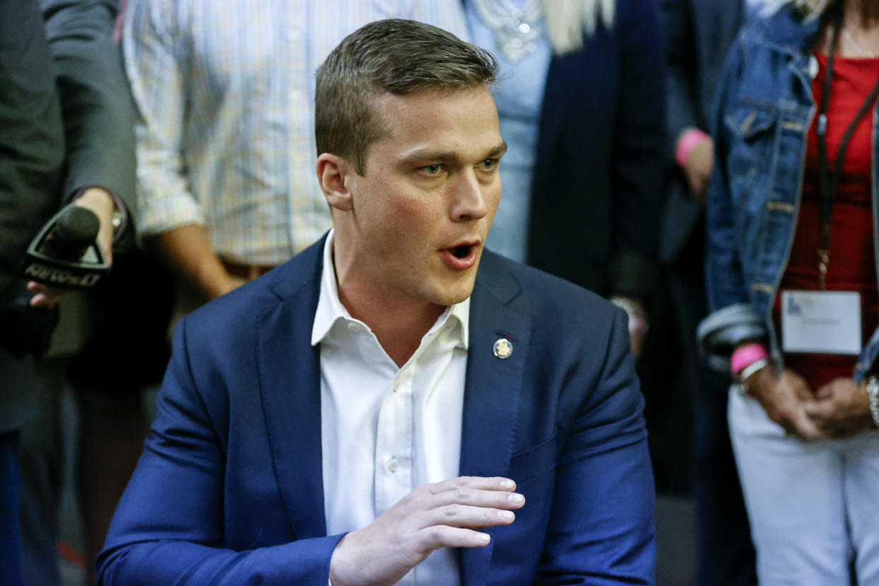 U.S. Rep. Madison Cawthorn, R-N.C., speaks to supporters and the media at his primary election night watch party in Hendersonville, N.C., Tuesday, May 17, 2022. (AP Photo/Nell Redmond)