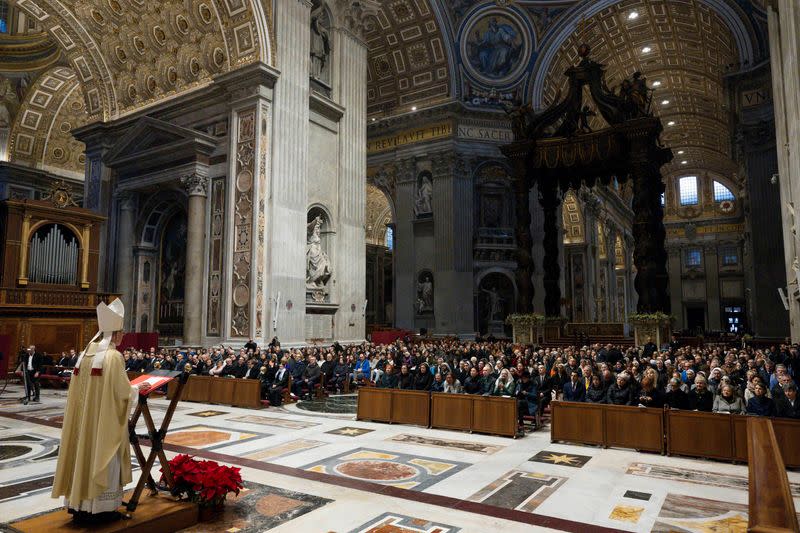 Benedict's top aide leads mass in memory of Pope Emeritus