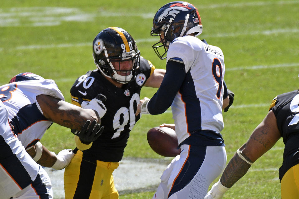 Pittsburgh Steelers outside linebacker T.J. Watt (90) sacks Denver Broncos quarterback Jeff Driskel (9) during the first half of an NFL football game in Pittsburgh, Sunday, Sept. 20, 2020. (AP Photo/Don Wright)