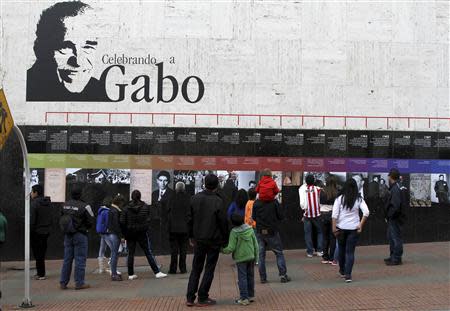 People look at images commemorating Colombian Nobel Prize-winning author Gabriel Garcia Marquez in Bogota April 18, 2014. REUTERS/Fredy Builes