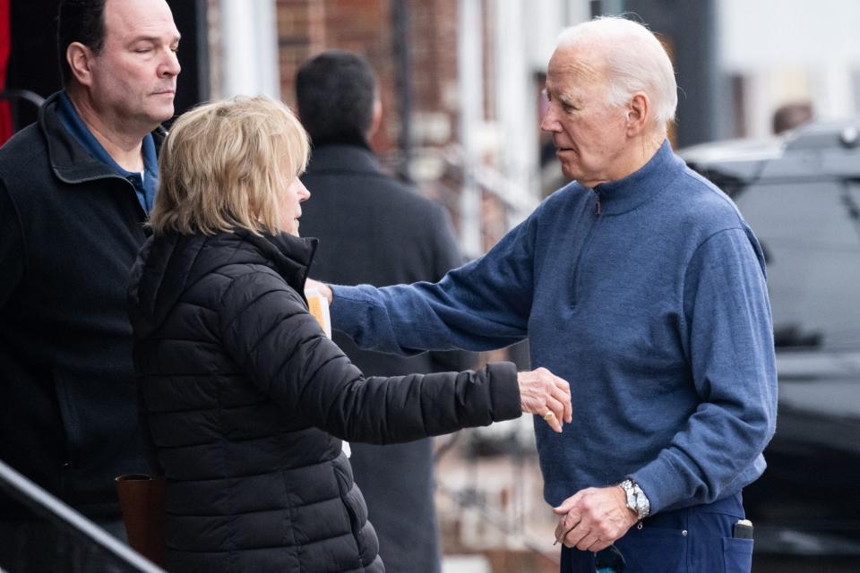 President Joe Biden embraces his sister Valerie Biden Owens as they leave Mrs. Robino's Restaurant in Wilmington on Feb. 10.