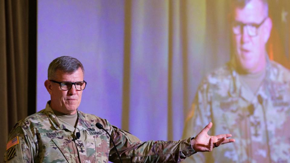 Gen. James Rainey, the Army Futures Command boss, waves his hand as he speaks Aug. 17, 2023, at the AFCEA TechNet Augusta conference in Georgia. (Colin Demarest/Staff)