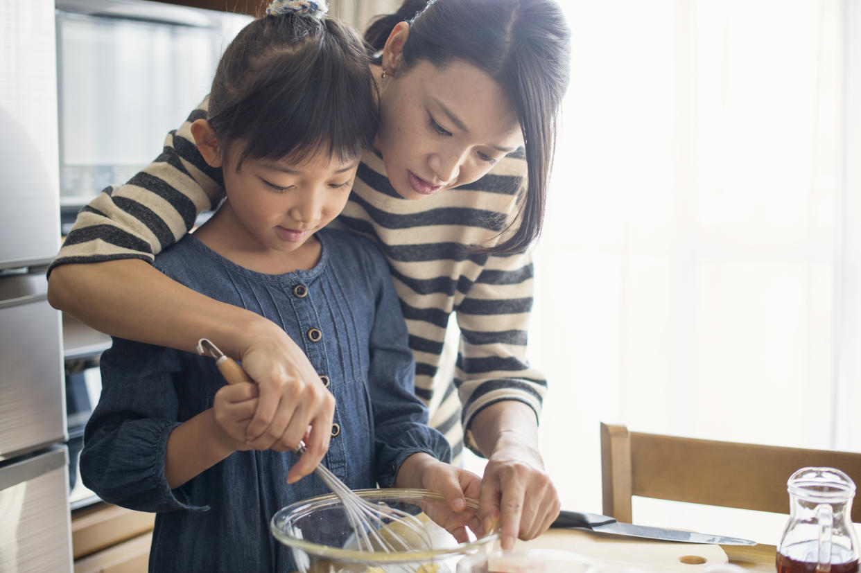 Mother and daughter making cookies together. (Photo: Gettyimages)