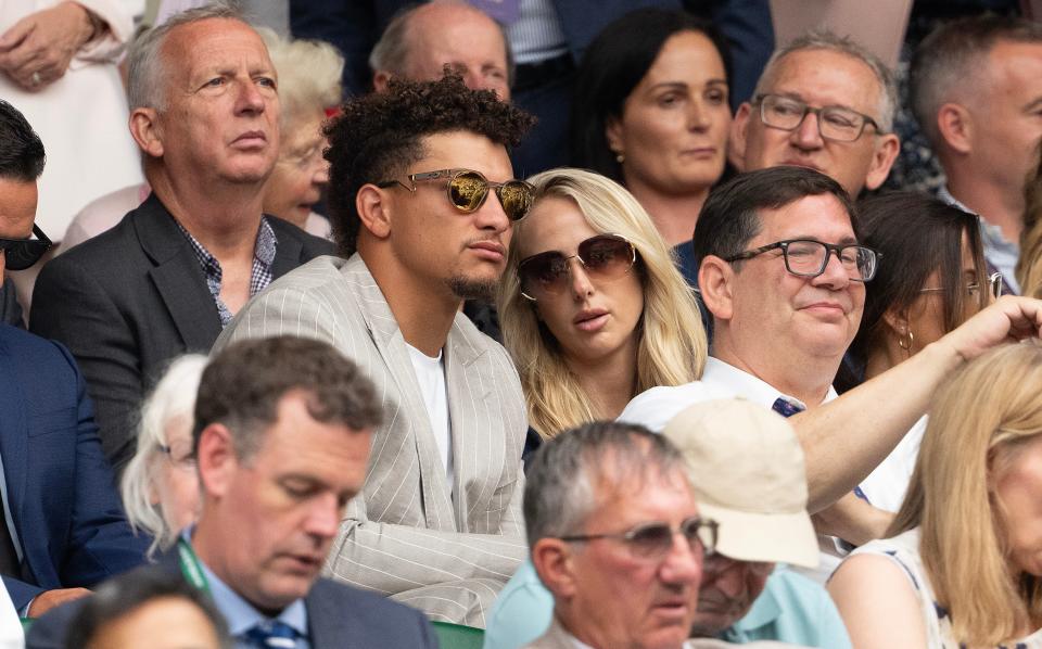 Kansas City Chiefs quarterback Patrick Mahomes, left, and soccer player Brittany Mahomes, right, in attendance for the Carlos Alcaraz of Spain and Frances Tiafoe of the United States match on day five of The Championships at All England Lawn Tennis and Croquet Club.